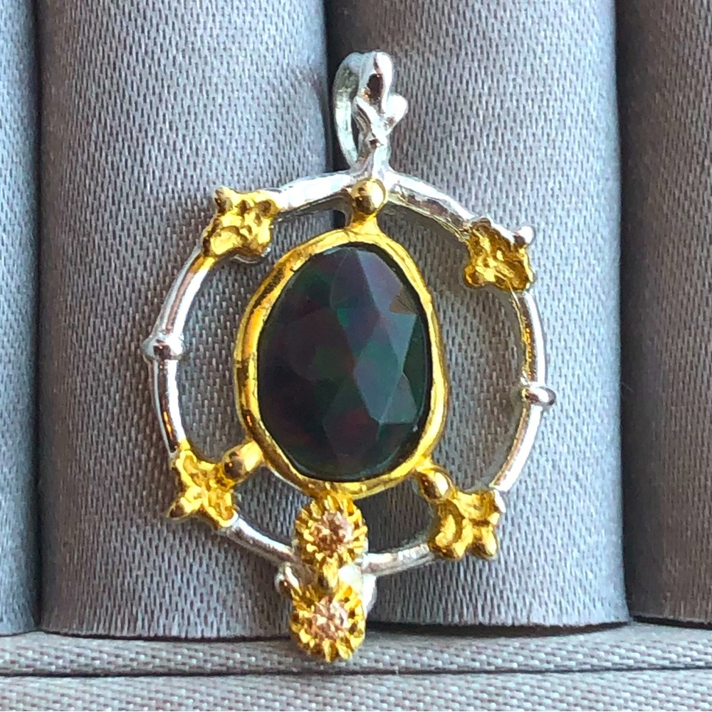 Sterling silver &  14kt gold (the gold is plated over SS) genuine black opal